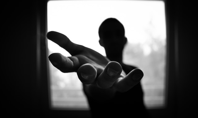 man-s-hand-in-shallow-focus-and-grayscale-photography-167964